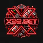 X92 Game with red neon casino symbols, playing cards, dice, cherries, and poker chips